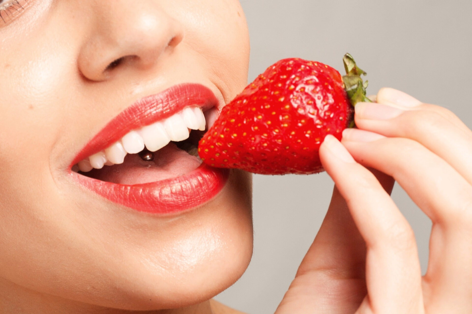 people-emotions-natural-food-beauty-lifestyle-concept-sexy-woman-eating-strawberry-sensual-lips-manicure-lipstick-desire-beauty-girl-sexy-lips-with-strawberry-white-teeth